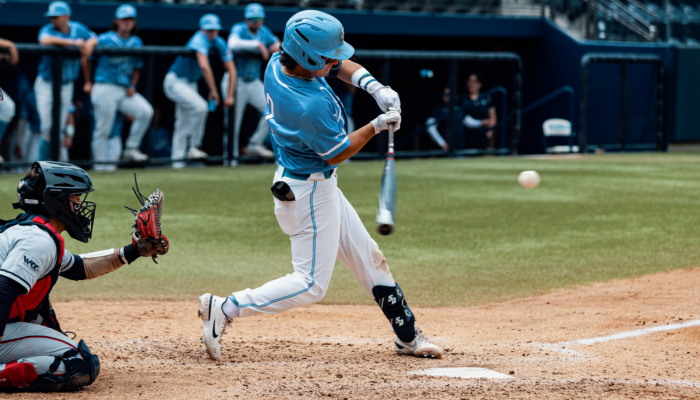 Playing Baseball in blue helmet and dress